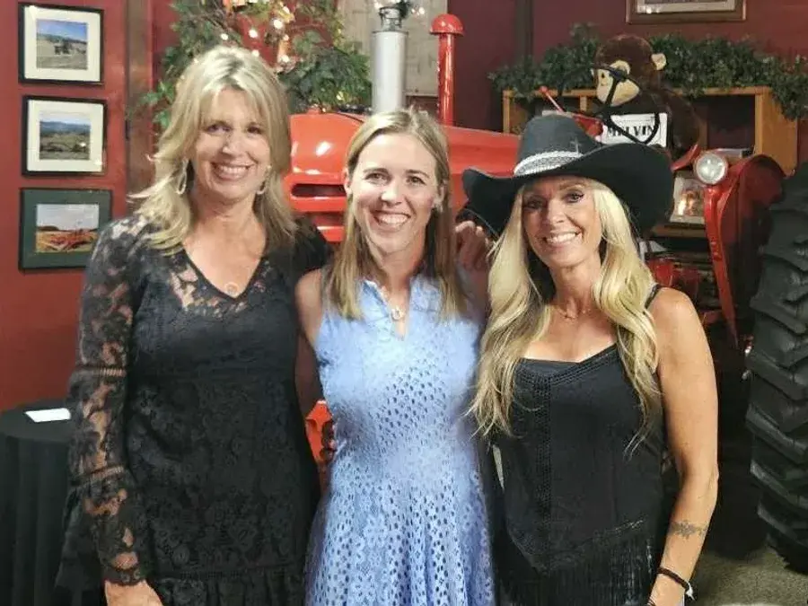 Three guests together inside the barn at a past Accelebrate
